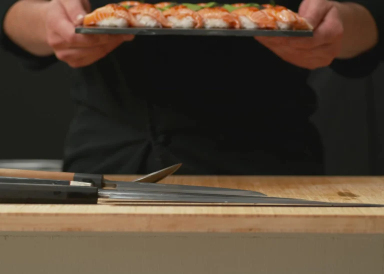 Chef presenting a platter of sushi